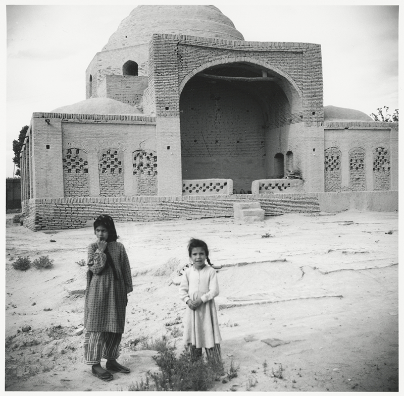 The tomb with children in foreground.